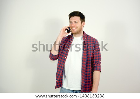 Young Man Talking on the Phone. Smiling
