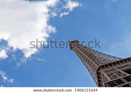 Paris, France - May 16, 2019 : Eiffel Tower or Tour Eiffel, world's most popular tourist attraction, historical monument and symbol of the capital, located on the Champ de Mars in Paris, France