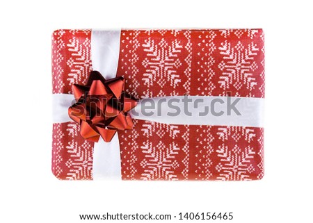 Christmas giftbox surprise, red box tied with white ribbon on an isolated background