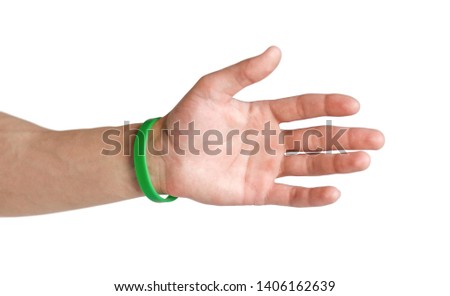 Colored rubber bracelets on the arm. Close up. Isolated on white background.