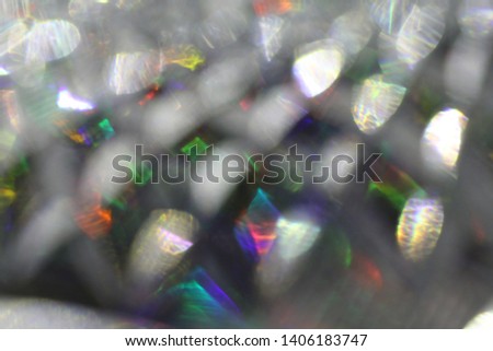 Blurred abstract creative background. Pink, purple, lilac and gray grid background. Lens flare. Colorful bokeh light. Illuminated burst. Lights of the night city. Colorful squares, rhombuses divorces.