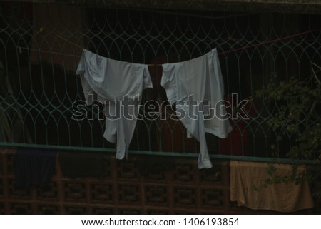 laundered shirts hanging   for drying 
