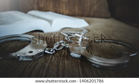 christian cross with handcuffs, concept of Jesus christ the savior liberate people from sin.