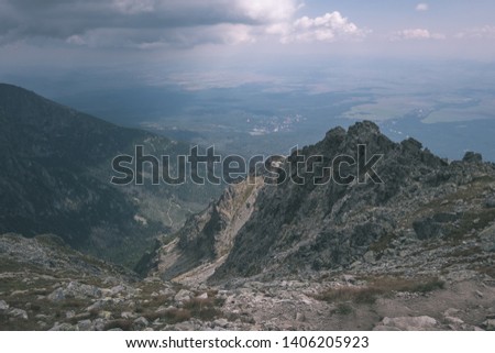 rocky hiking trails for tourists in western carpathian Tatra mountains in slovakia. clear summer day for hiking and adventure - vintage old film look
