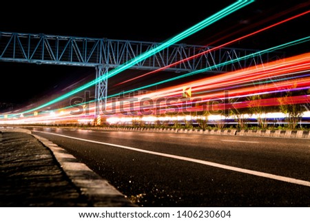 Long exposure photographs of night traffic of Indian national highway. A view from Kerala, India