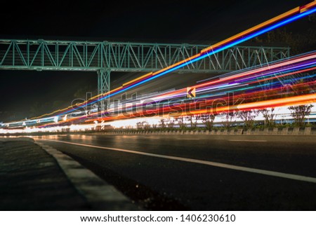 Long exposure photographs of night traffic of Indian national highway. A view from Kerala, India