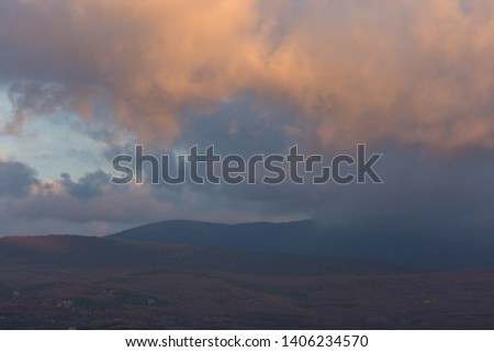 Cumulus clouds in the evening sunset sky