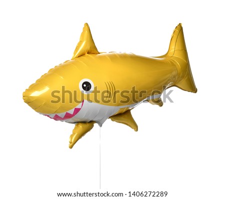 Yellow shark fish metallic balloon isolated on a white background