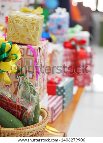 blur defocused picture stack of colourful wrapped new year gift boxes on a table in celebration or anniversary party for backdrop background use