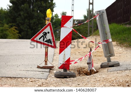 Road construction site with signs
