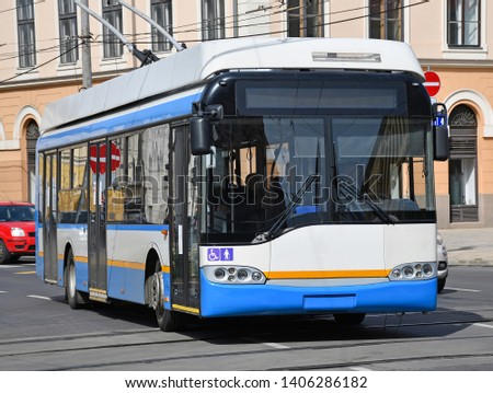 Trolley bus on the street of the city Royalty-Free Stock Photo #1406286182
