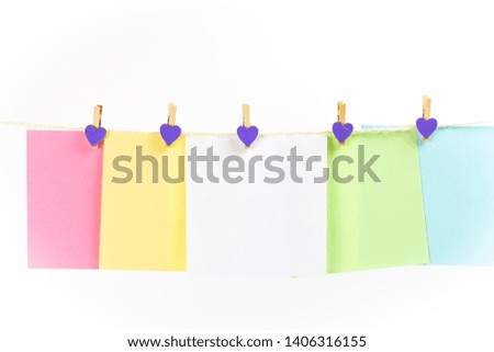 Colorful paper cards hanging rope isolated on white background. Place for your text.
