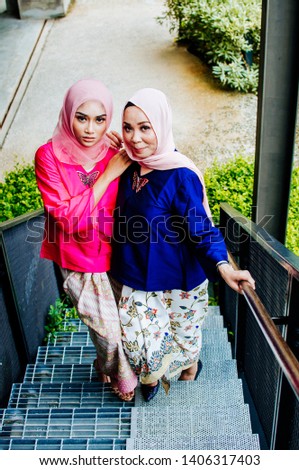 Fashion portrait of two muslim woman wearing hijab