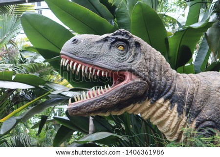 Angry dinosaur in botanicl garden