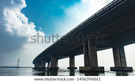 View of the Third Mainland Bridge from a boat in Lagos Royalty-Free Stock Photo #1406396861