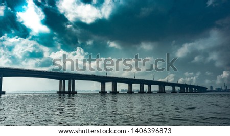 View of the Third Mainland Bridge from a boat in Lagos Royalty-Free Stock Photo #1406396873