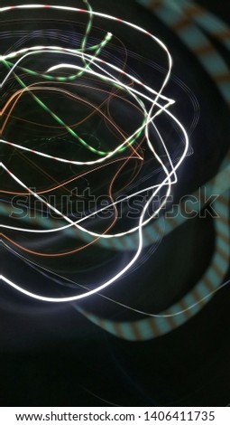Abstract colorful light trails of the night city, Light effects. Neon glow. Festive decoration. Abstract blurred background. 