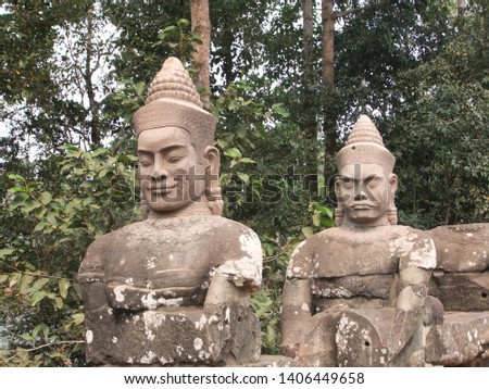 pictures of statues taken in the Angkor temple complex in Cambodia