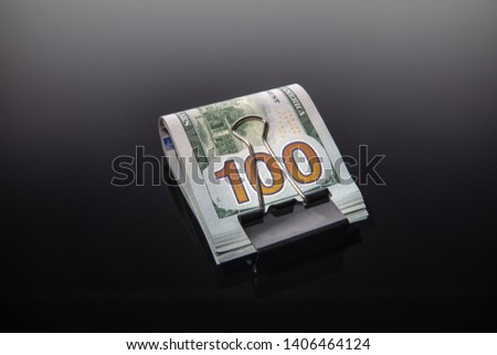 Bundle of dollars on a black background