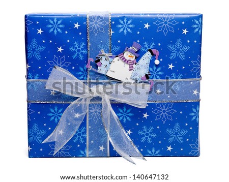 Close-up image of a blue Christmas gift box with snowman sticker isolated over white background.