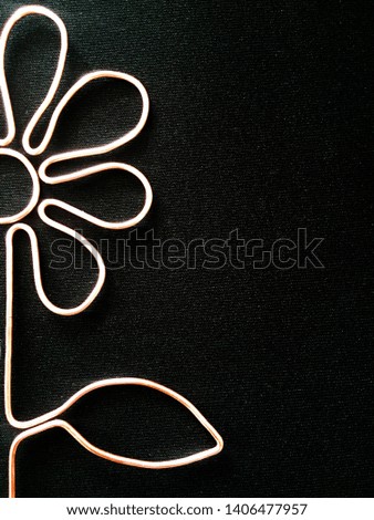 Metal flower on black background