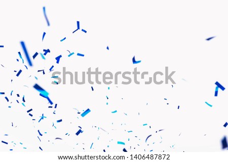 Confetti from crackers. Blue elements on a white background. Shot of confetti at a party. Festive mood. Serpentine, festive decor Royalty-Free Stock Photo #1406487872