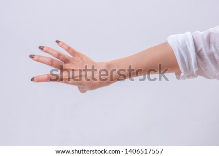 Arms stretched out and the hands of women Make gestures from fingers