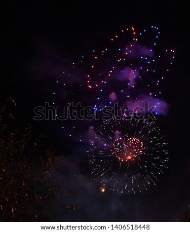 Exploding multi colored fireworks in night sky