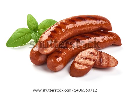 Grilled bratwurst Pork Sausages with basil leaves, close-up, isolated on white background. Royalty-Free Stock Photo #1406560712