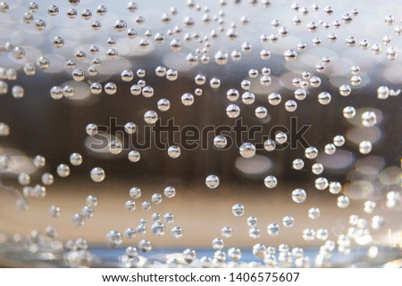 The white bubbles  isolated on the glass