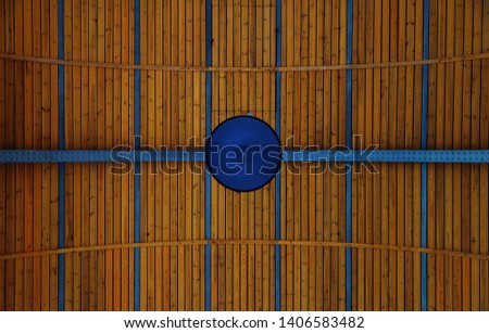 Lines and Shapes - Abstract of a lamp hanged on a wooden ceiling