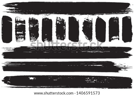 A set of grunge vector brushes. Strokes of black paint on white paper