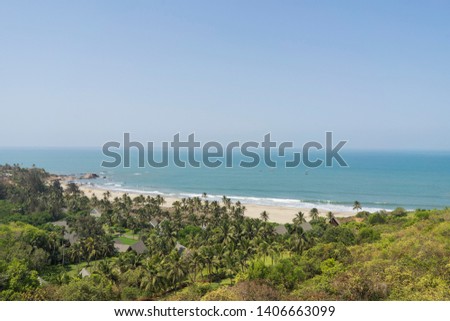 Anjuna Beach Goa India, Beautiful nature and landscape photo of popular tourist vacation destination. Nice warm sunny summer day.