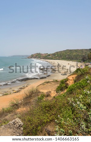 Anjuna Beach Goa India, Beautiful nature and landscape photo of popular tourist vacation destination. Nice warm sunny summer day.