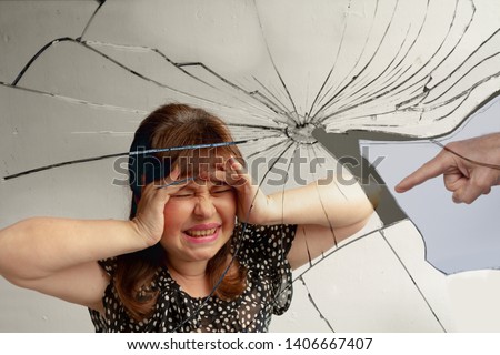 Broken into many fragments image of a woman, clutching her hands with her head with a grimace of despair, the concept of gaslighting, psychological violence, stress Royalty-Free Stock Photo #1406667407