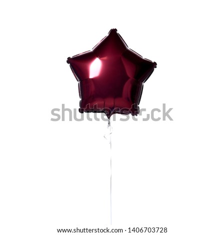 Single dark red big star metallic balloon object for birthday isolated on white background