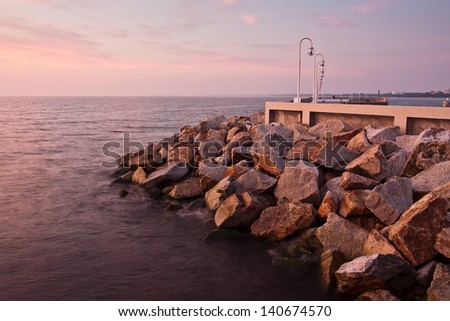 Sunrise on the pier at the seaside, Gdynia Orlowo, Poland.Long exposure photography