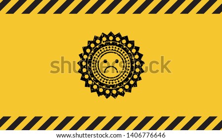 sad face icon black grunge emblem with yellow background. Vector Illustration. Detailed.