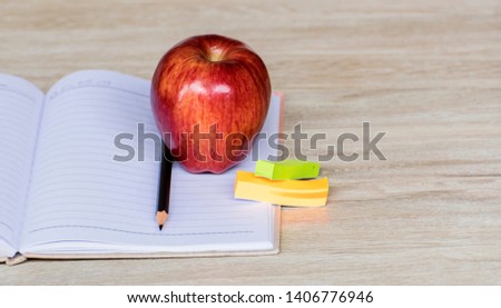 Education concept, Red aple write book colorful pens and global with wooden backgrounds.learning in twenty-One century. Knowledge management. Innovation active for student.selective focus image. 