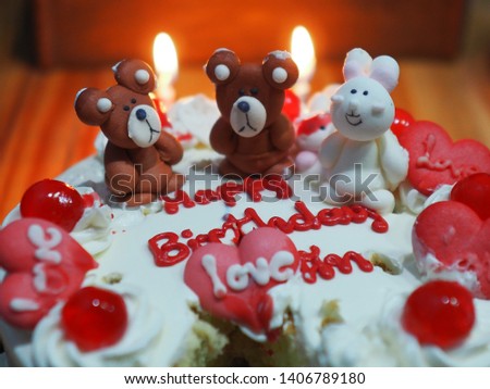 Birthday cake with candles on blur background