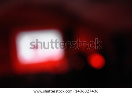 blurry computer screen in dark room background