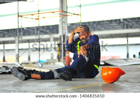 Senior worker accident fall of the scaffolding and headache with broken leg in construction site health insurance concept. Royalty-Free Stock Photo #1406835650