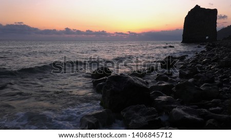 Black sea at sunset. Monument of nature - Sail Rock, or Parus Rock. Royalty-Free Stock Photo #1406845712