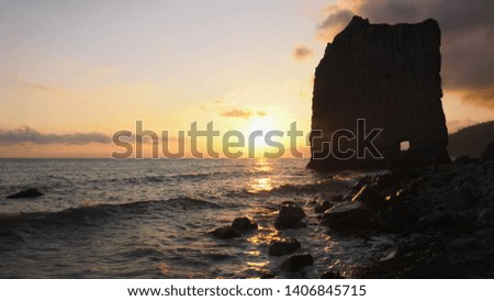 Black sea at sunset. Monument of nature - Sail Rock, or Parus Rock. Royalty-Free Stock Photo #1406845715