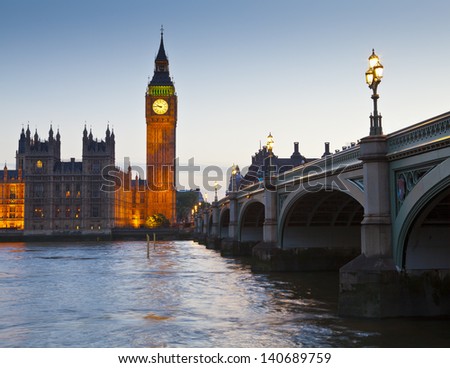 Chrome blue sky reflections over the neo-gothic Houses of Parliament, iconic Big Ben (1834) and sweeping arches of Westminster bridge in the heart of london.