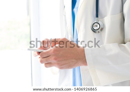 closeup hands doctor with mobile phone