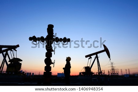 In the evening，oil field, the oil workers are working