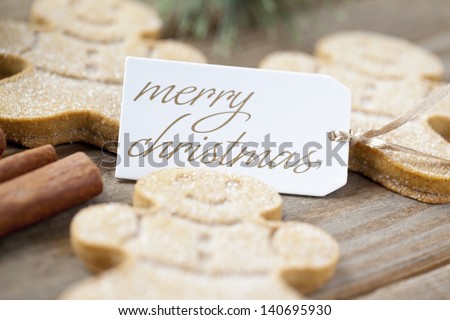 A shot with low depth of field of gingerbread men with a Merry Christmas tag.