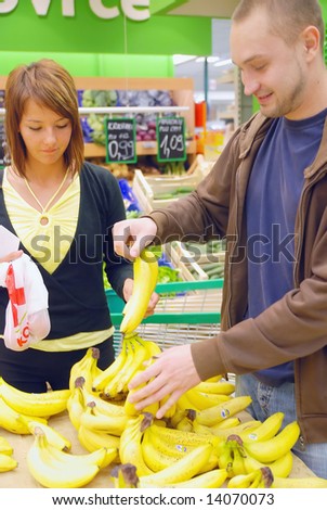 happy young couple in shopping