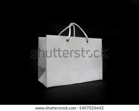 White paper bag mock up with handles on Black background. High resolution.